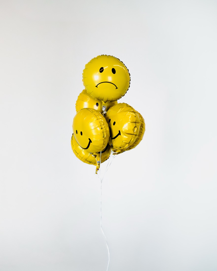 BBYFERG sitting under a bunch of balloons