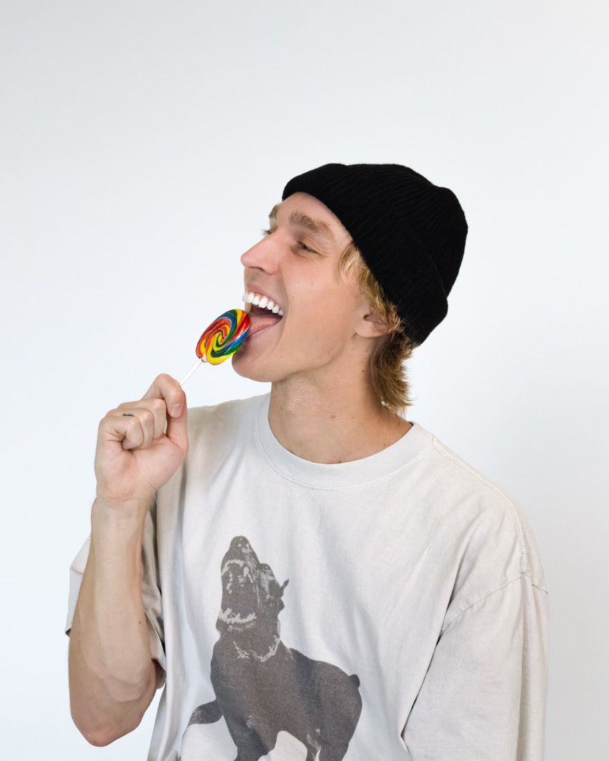 BBYFERG licking a lollipop